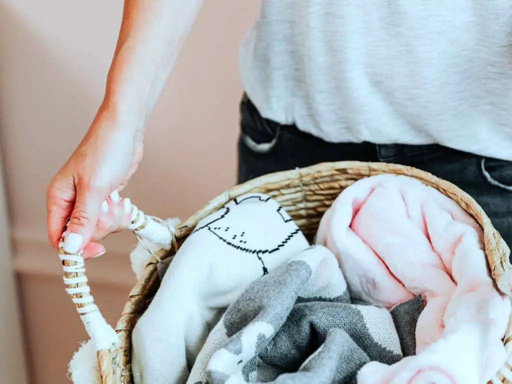 Receiving blankets and swaddles in a basket