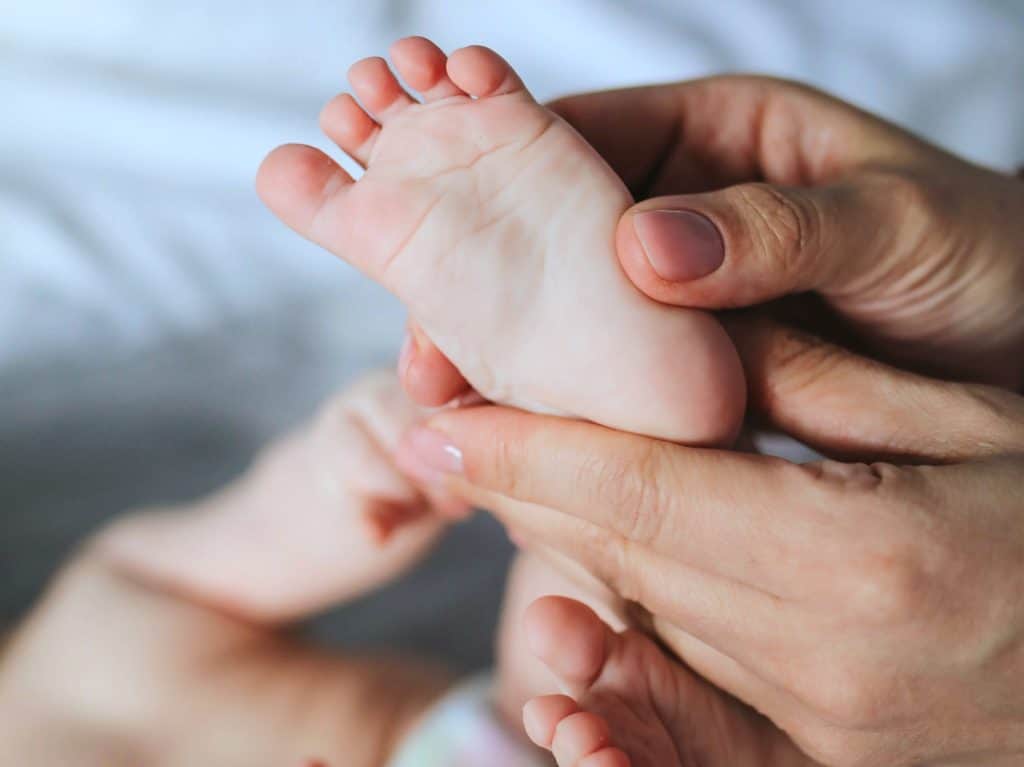 Newborn receiving a sponge bath