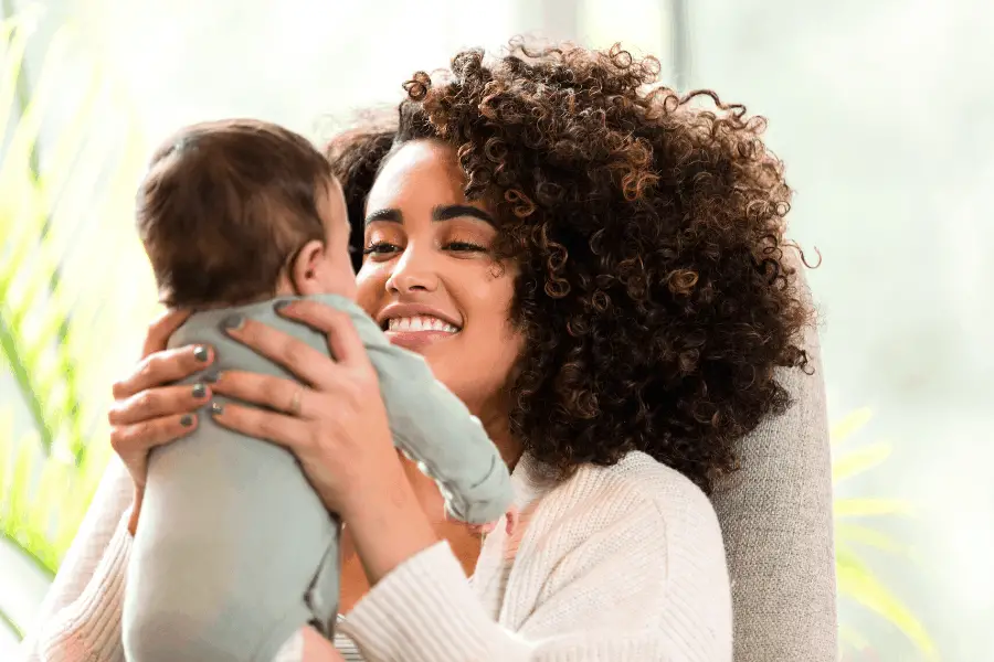 happy mom who knows how to survive the newborn stage