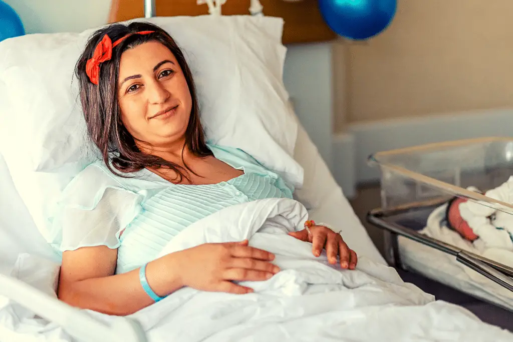 new mom wearing her own clothes after giving birth in the hospital
