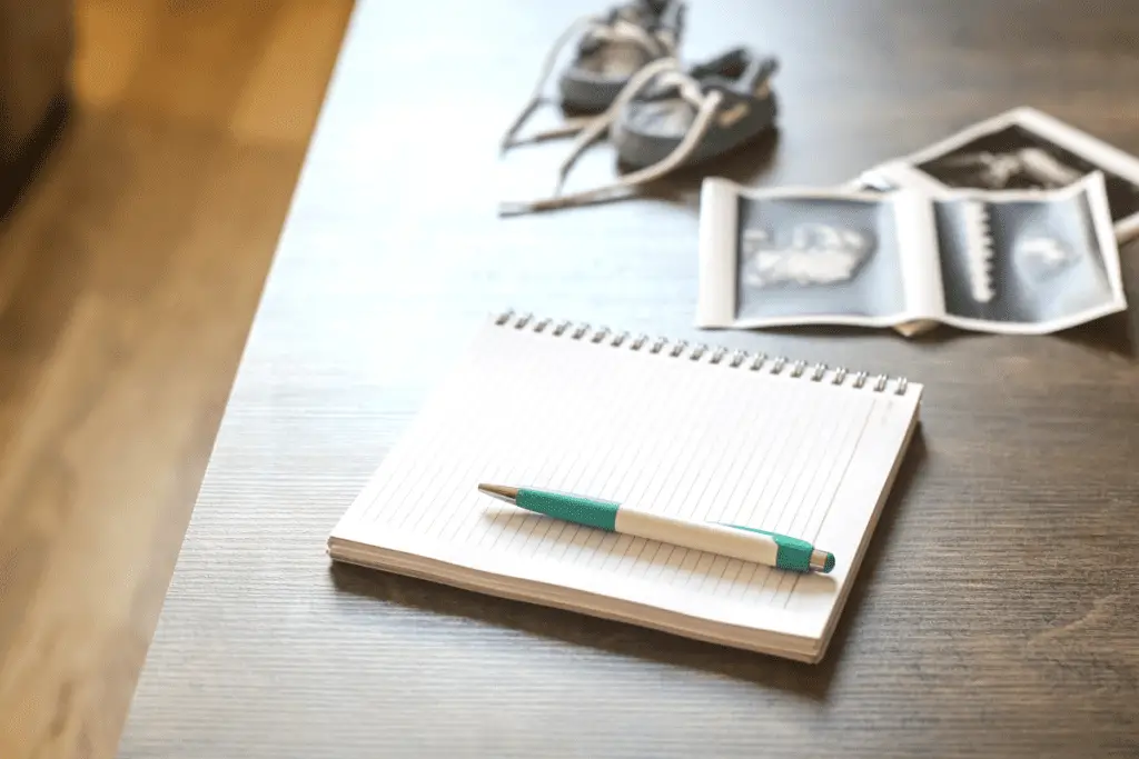 notebook with pen ready to have baby names written down