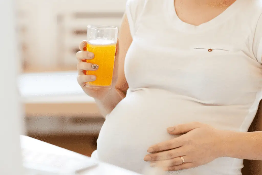 woman inducing her labor at home with the midwives brew