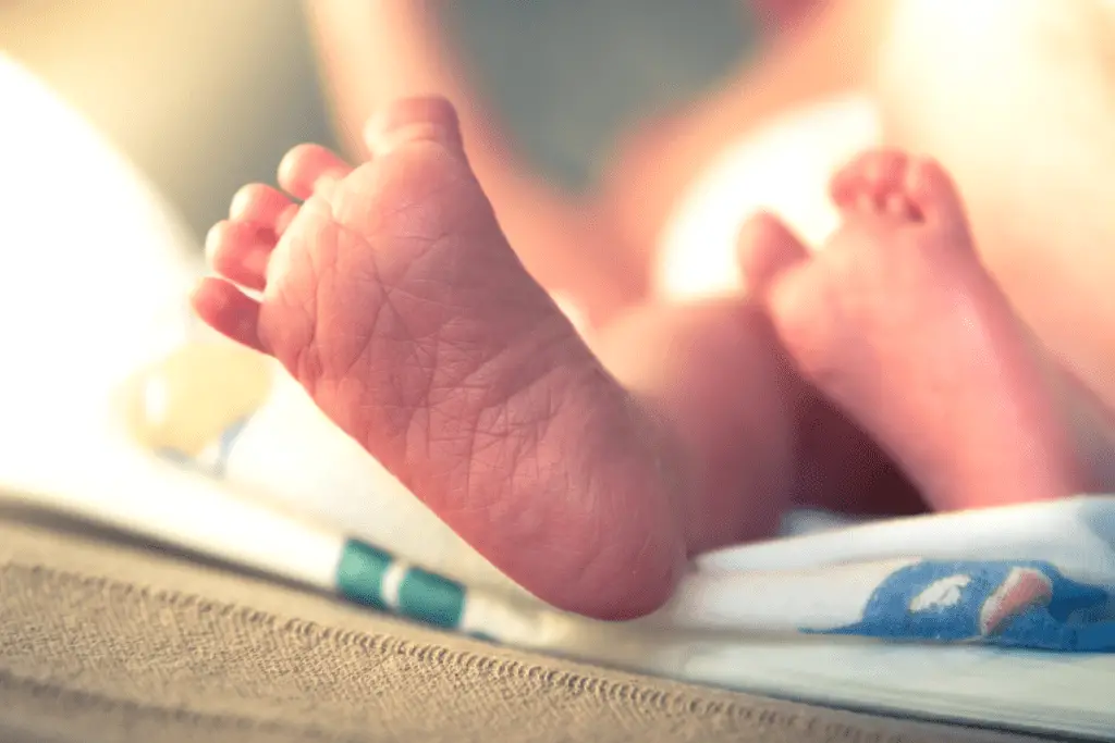 newborn baby feet directly after birth
